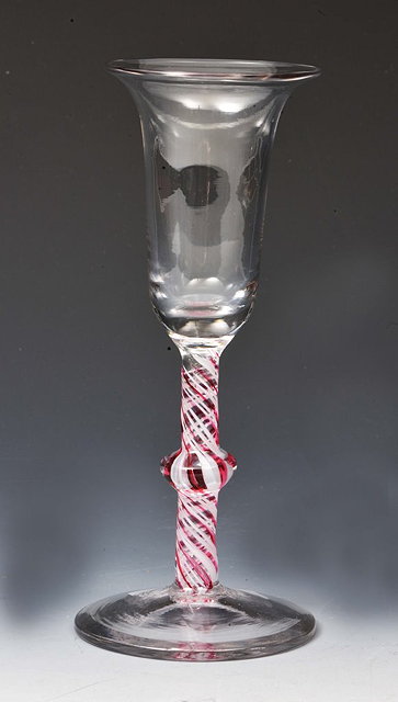 Appraisal: AN ENGLISH ALE GLASS with red and white spiral coloured