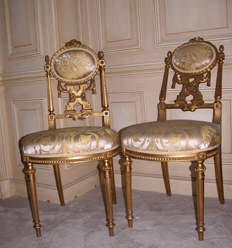 Appraisal: Title Pair carved and gilded Louis XVI-style side chairs with