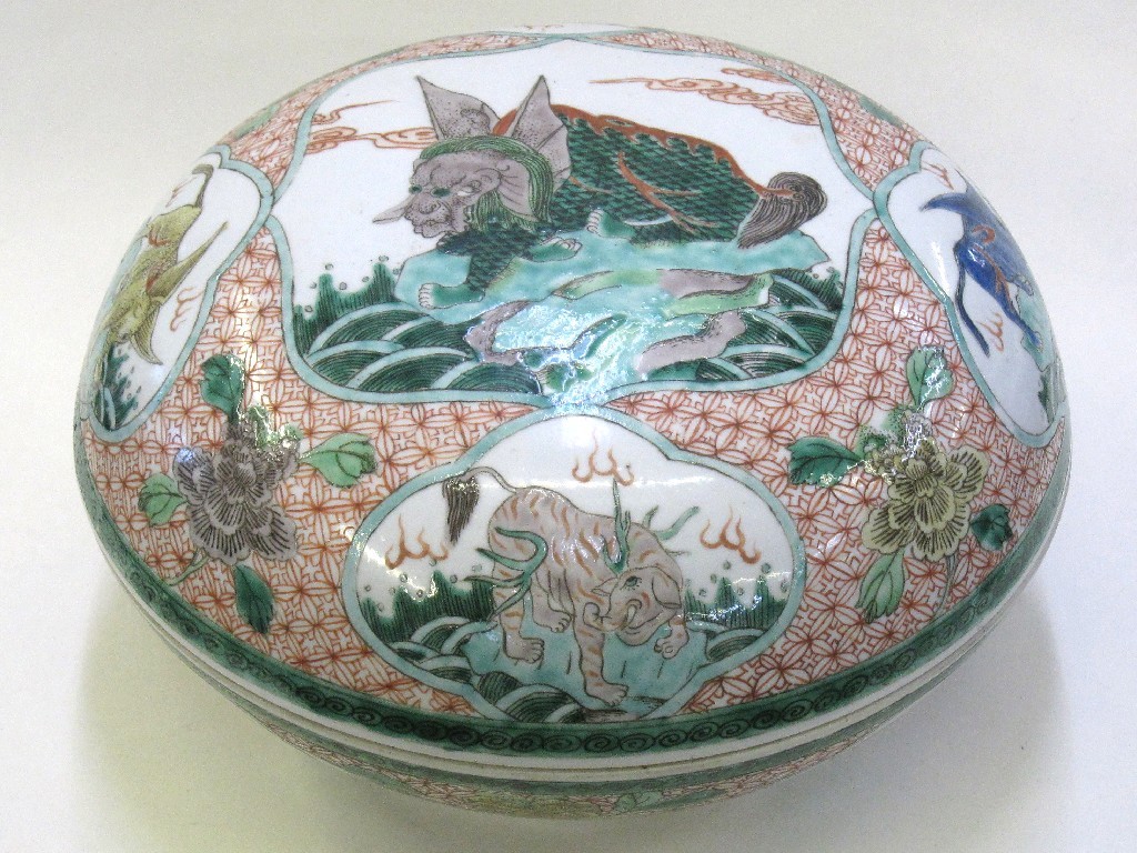 Appraisal: Large oriental pottery circular box and cover decorated with mythical