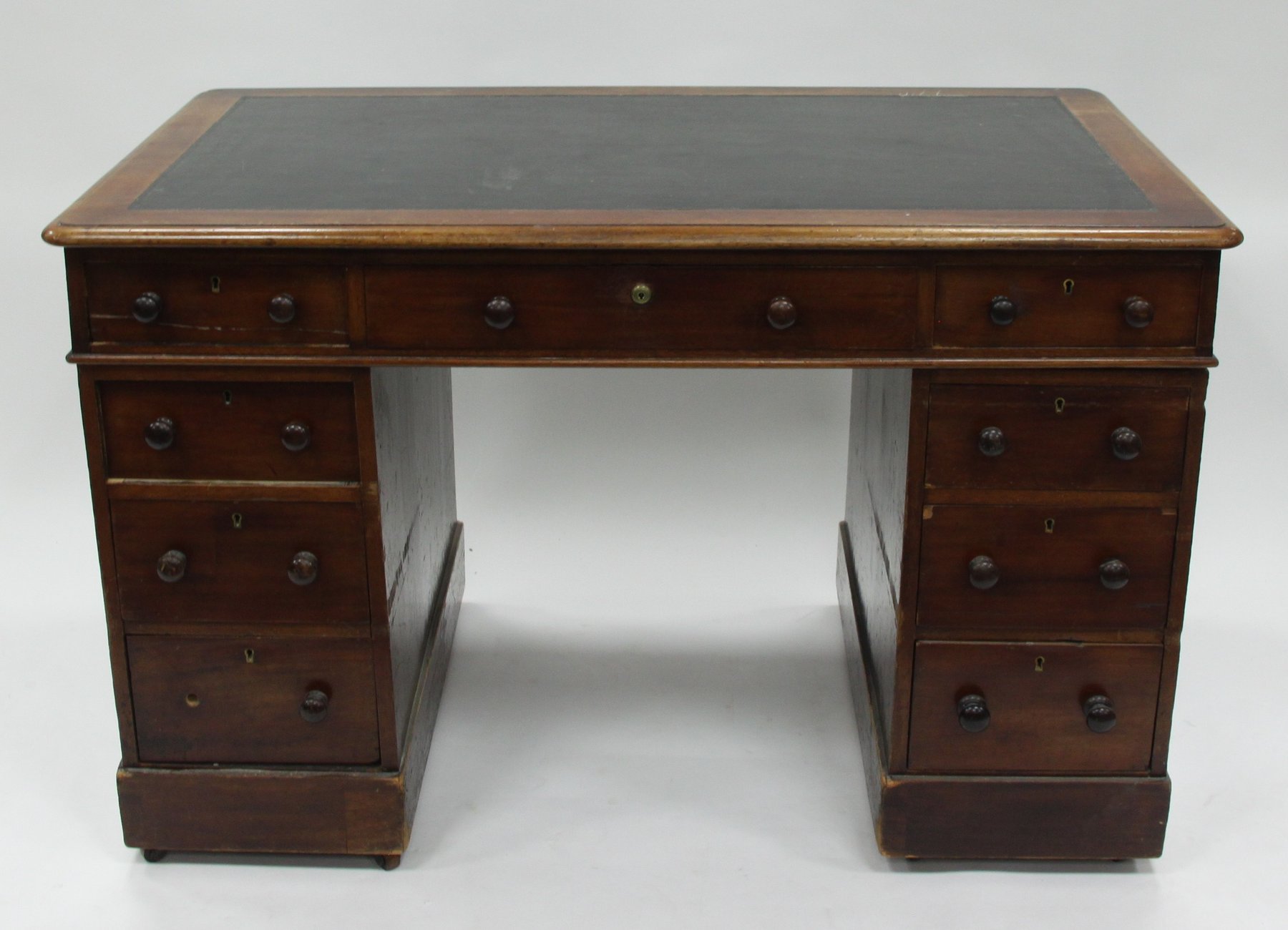 Appraisal: A Victorian mahogany pedestal desk fitted nine drawers around a