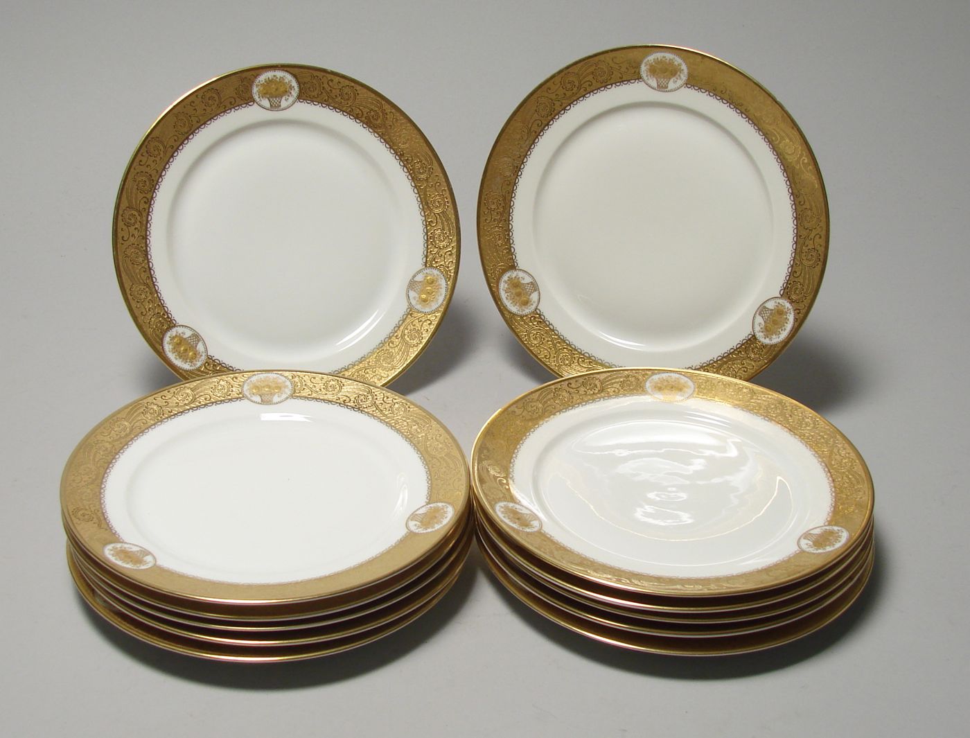 Appraisal: TWELVE ROSENTHAL BREAD AND BUTTER PLATES With gilt border in