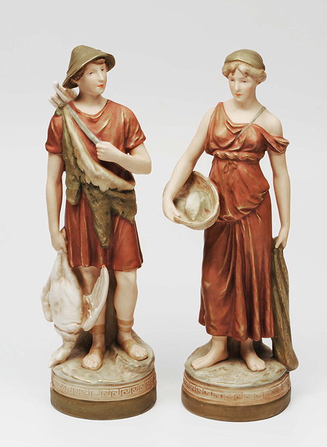 Appraisal: A PAIR OF ROYAL DUX porcelain figures the hunter and