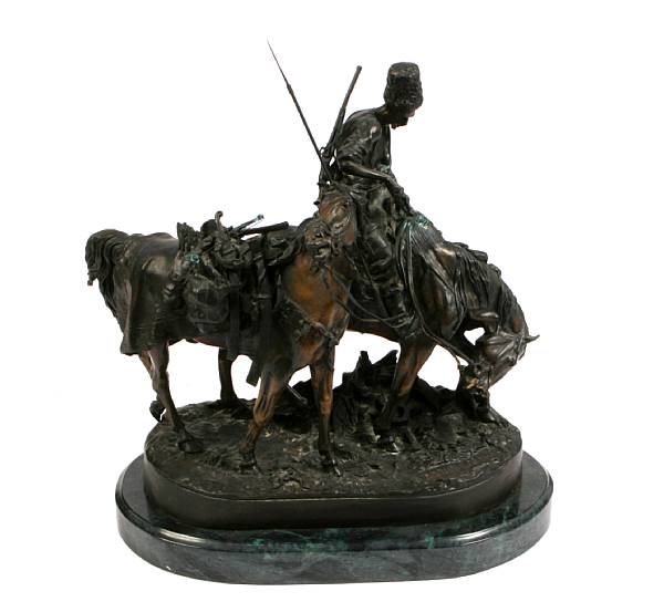 Appraisal: A patinated bronze figure of a cossack on horseback after