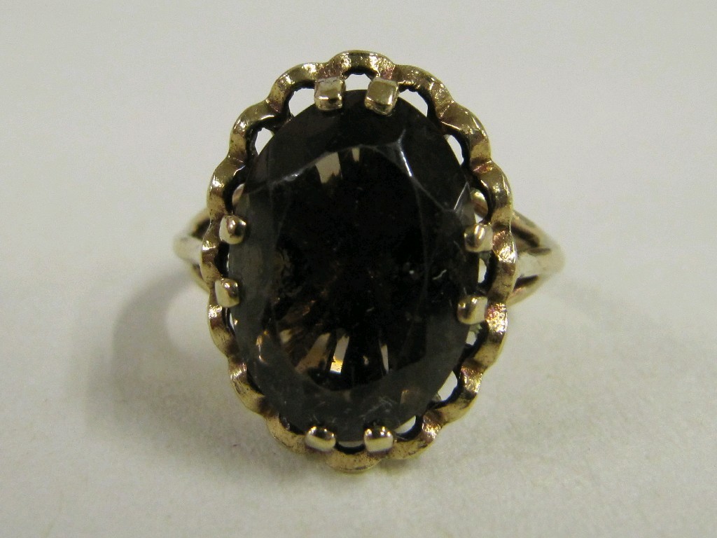 Appraisal: Nine carat gold smokey topaz single stone ring