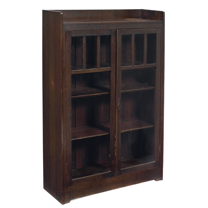 Appraisal: Arts and Crafts bookcase two-door form each door with three