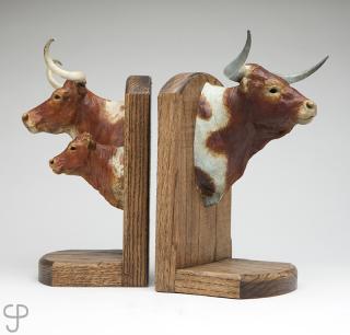 Appraisal: Vel Miller Three bronzes mounted on two wooden bookends Longhorn