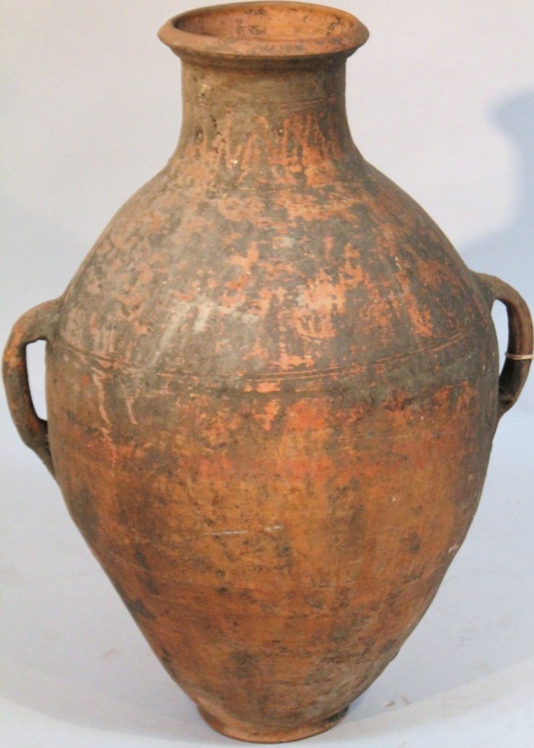 Appraisal: A thC baked earthenware Grecian style flagon the bulbous body