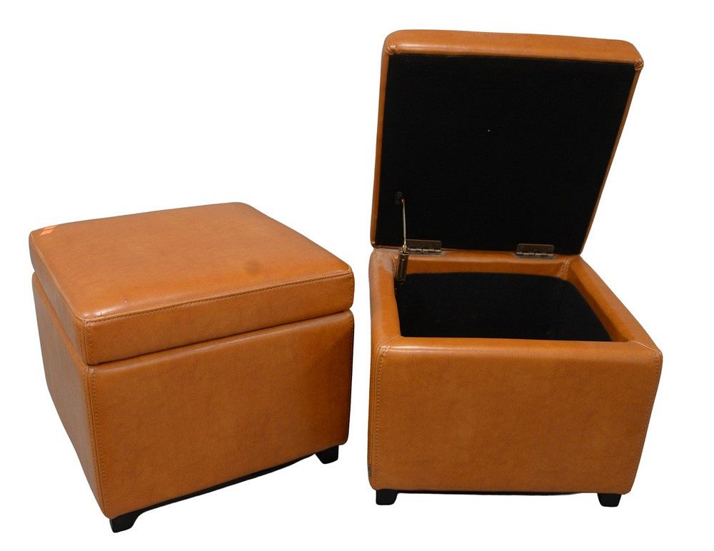 Appraisal: Pair of Brown Leather Ottomans having lift top opening to