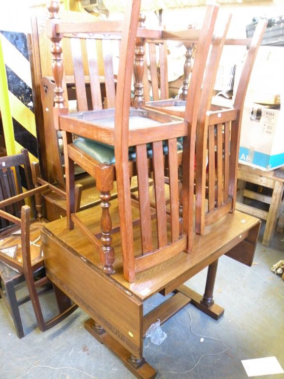 Appraisal: An oak drop leaf table and four dining chairs