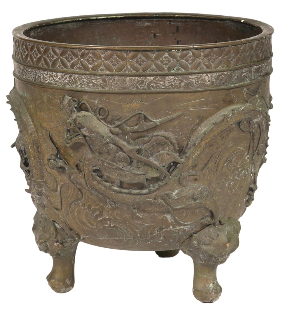 Appraisal: LARGE ASIAN BRONZE FOOTED JARDINIEREAsian large bronze jardiniere cast in