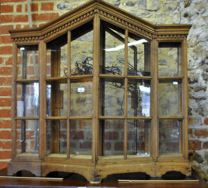 Appraisal: A Victorian oak counter-top display cabinet with arched top canted