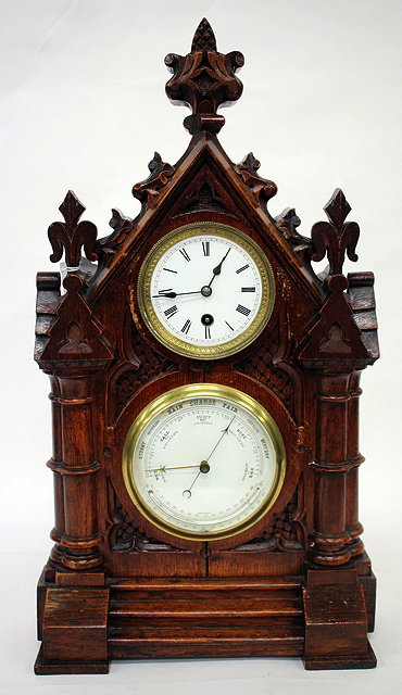 Appraisal: AN ANTIQUE OAK CASED MANTLE CLOCK AND BAROMETER two circular