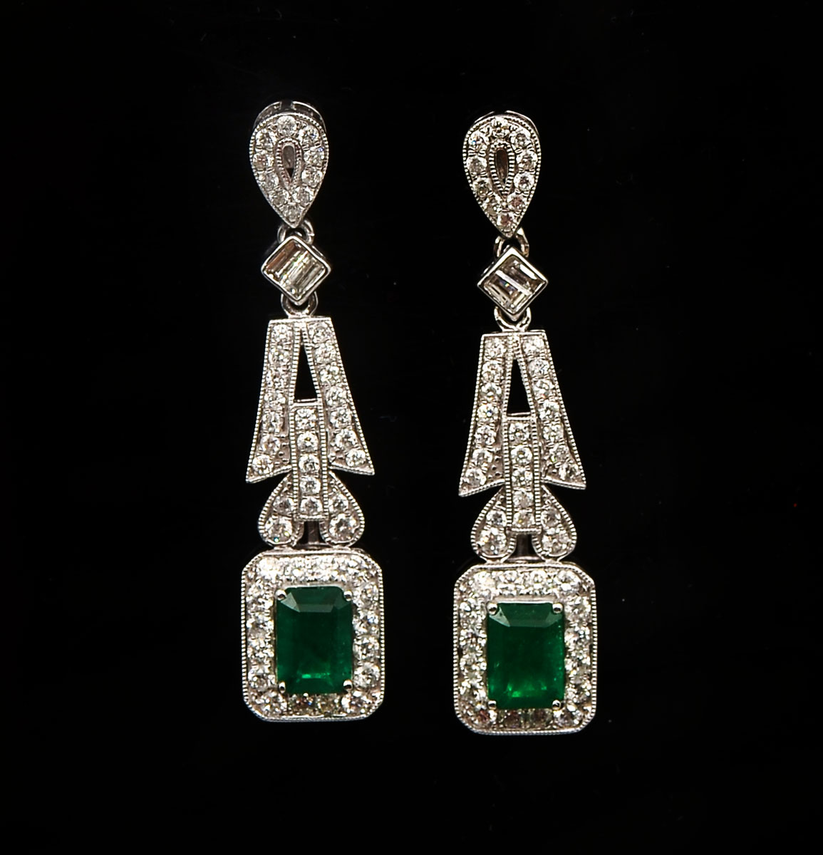 Appraisal: K EMERALD DIAMOND EARRINGS BY ORIANNE emerald cut emeralds approx