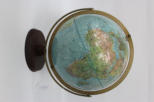 Appraisal: A MODERN DESK TOP GLOBE on a circular hardwood base