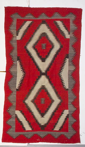 Appraisal: A Navajo rug With central conjoined pair of stepped and