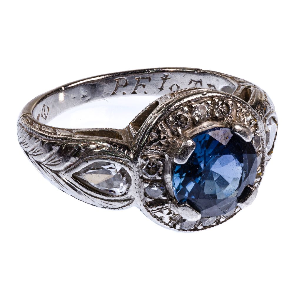 Appraisal: PLATINUM SAPPHIRE AND DIAMOND RINGHaving a round cut sapphire weighing