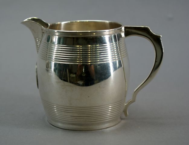 Appraisal: A sterling silver barrel form creamer makers mark indistinct London