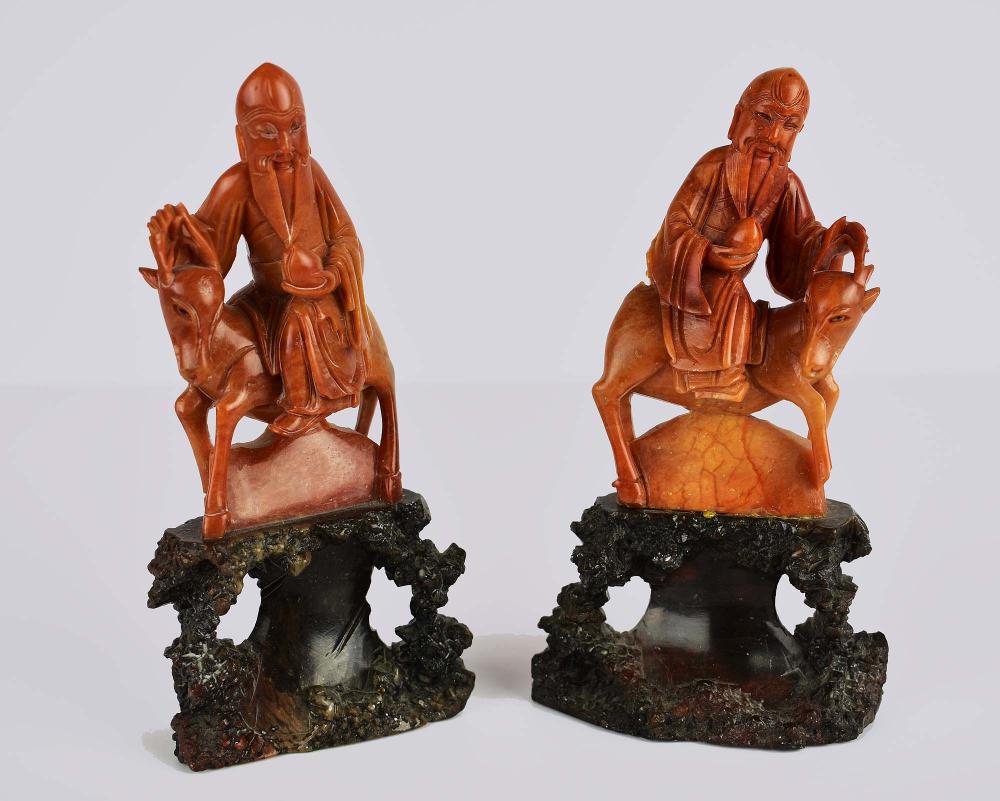 Appraisal: PAIR OF CHINESE SOAPSTONE SAGES ON DEER th Century Each