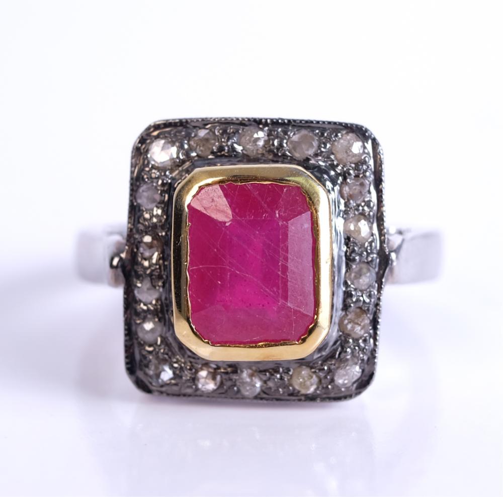 Appraisal: STERLING SILVER RUBY AND DIAMOND RINGSterling silver ruby and diamond