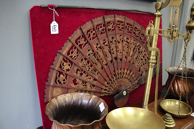 Appraisal: AN ORIENTAL CARVED GILDED WOODEN FAN of large proportions and