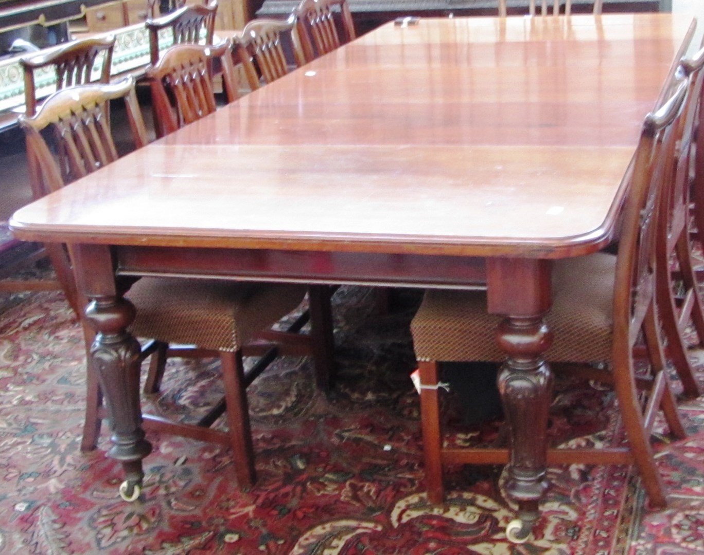 Appraisal: A th century mahogany extending dining table the rounded rectangular