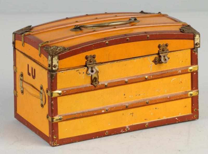 Appraisal: Early French Camel Back Trunk Biscuit Tin Description Marked Grand