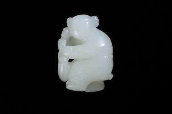 Appraisal: CHINESE WHITE JADE FIGURE OF BOY Standing holding a bag