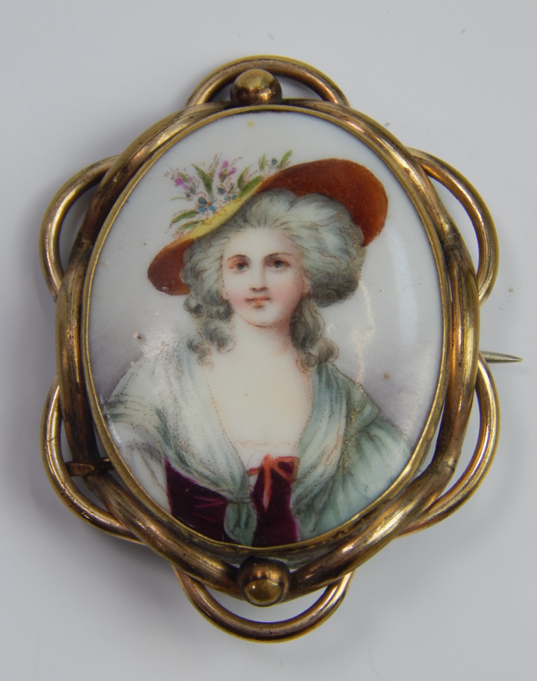 Appraisal: A Victorian enamel brooch with half length portrait of a