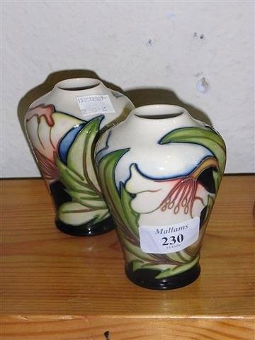 Appraisal: A PAIR OF MOORCROFT BALUSTER FORM VASES with all over