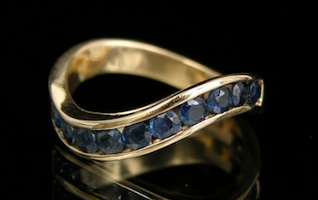 Appraisal: A Gold Wave Ring set with Sapphires k yellow gold