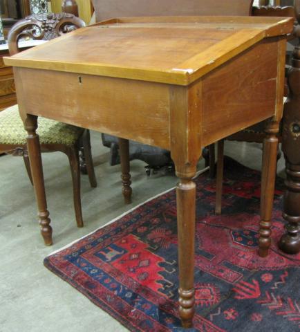 Appraisal: Primitive slant-top desk with locking interior and shelves turned legs