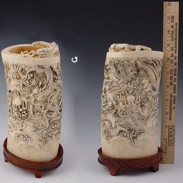 Appraisal: CARVED IVORY TUSK VASE Heavily carved with dragons figural birds