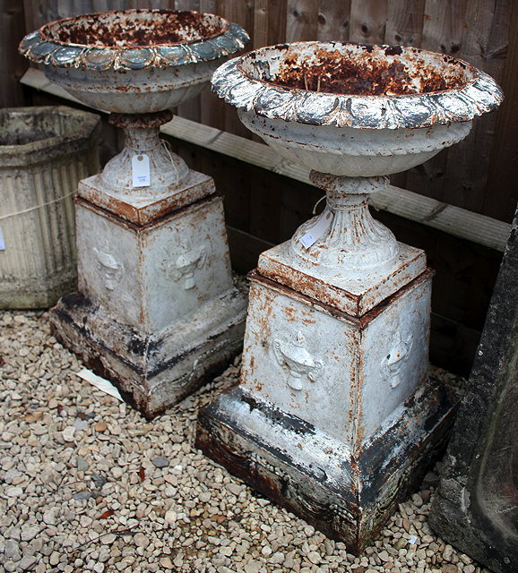 Appraisal: A PAIR OF ANTIQUE WHITE PAINTED CAST IRON GARDEN URNS