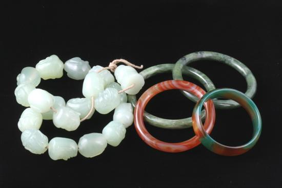 Appraisal: FIVE ITEMS CHINESE JADE AND HARDSTONE JEWELRY Four various round