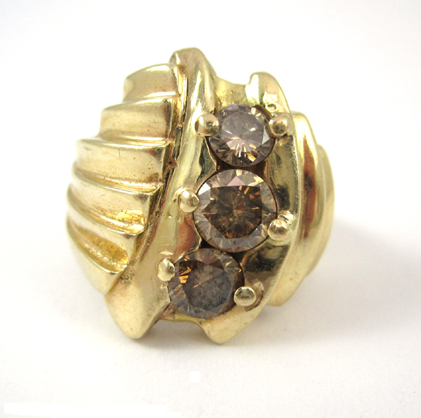 Appraisal: COGNAC DIAMOND AND FOURTEEN KARAT GOLD RING set with three