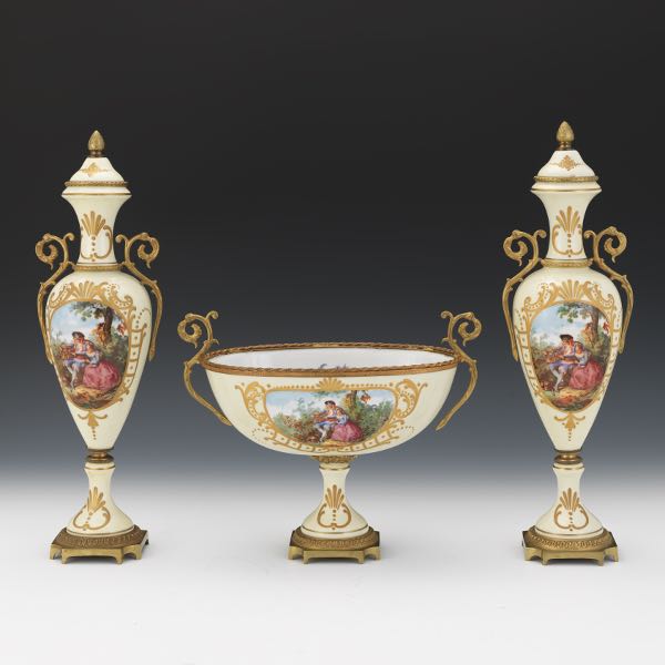 Appraisal: FERDINAND BING FRENCH GILT BRASS AND PORCELAIN THREE-PIECE GARNITURE vases