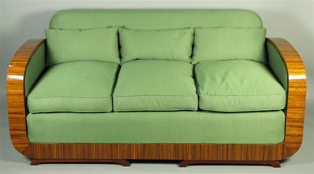 Appraisal: ART DECO UPHOLSTERED SOFA WITH POLISHED VENEERED ARMS having a