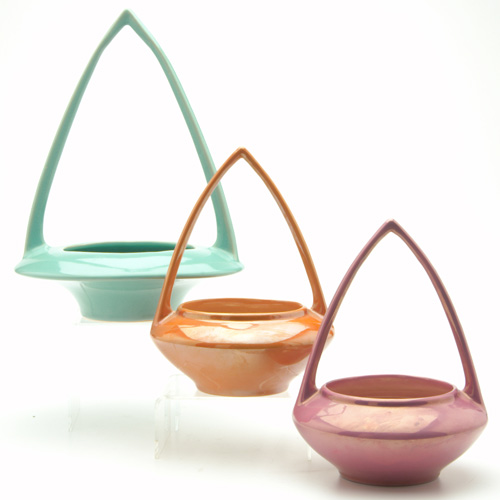 Appraisal: ROSEVILLE Three unusual Lustre Ware baskets with tall pointed handles