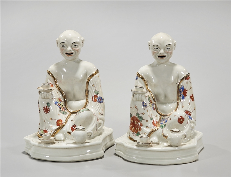 Appraisal: Two Chinese porcelain seated figures x x approx Condition wear