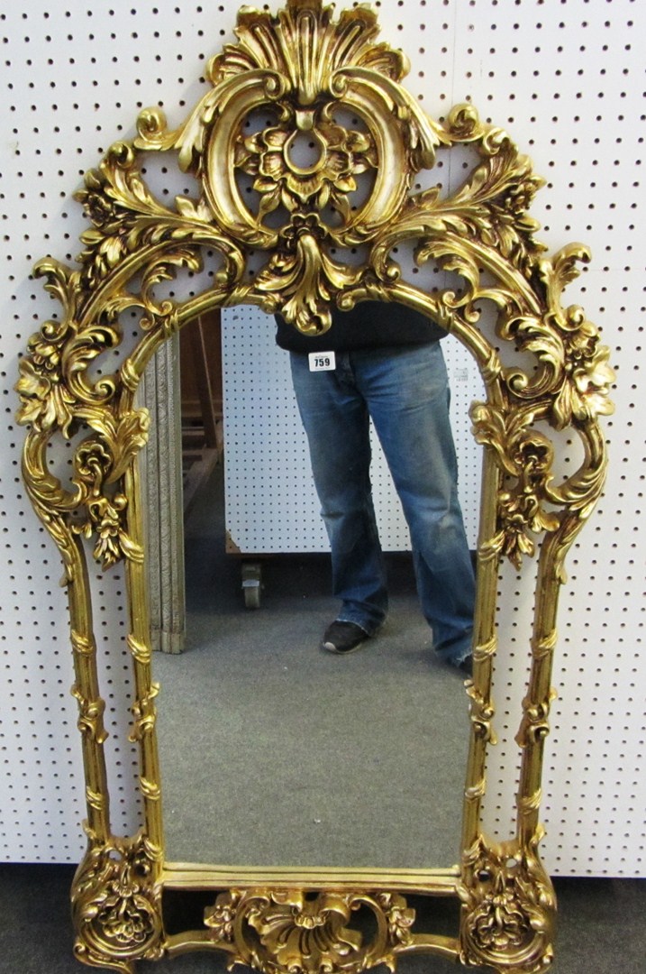 Appraisal: A th century gilt framed arch top wall mirror with