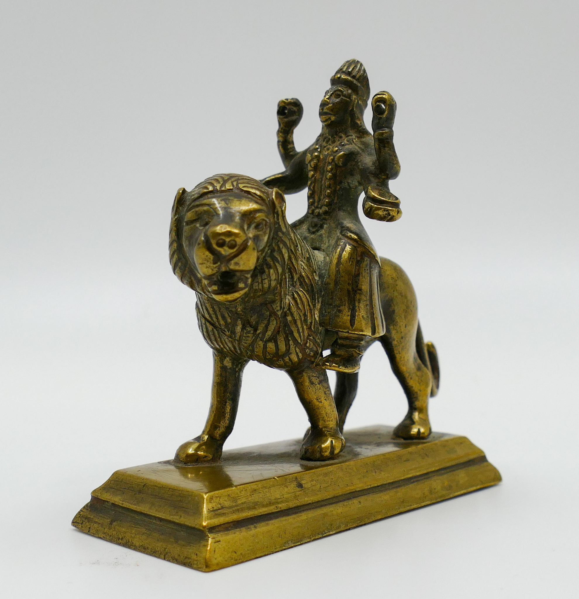 Appraisal: Old Indian Brass Kali Riding a Lion Figure ''x ''