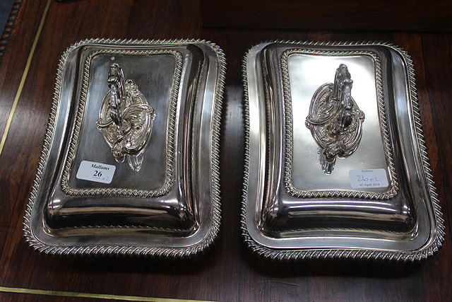 Appraisal: A PAIR OF SILVER PLATED ENTREE DISHES with gadrooned edges