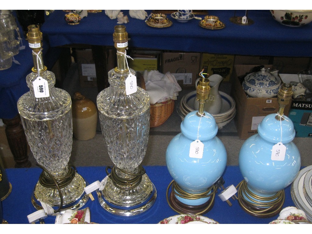 Appraisal: Two glass lampbases and a pair of blue glazed lampbases