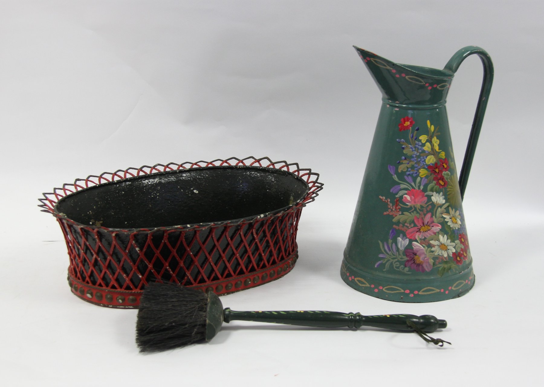 Appraisal: A painted wirework basket of oval form with trellis sides