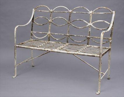 Appraisal: ENGLISH PAINTED WROUGHT IRON GARDEN SEAT The openwork back with