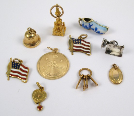 Appraisal: TEN CHARM BRACELET CHARMS including two American flag charms a