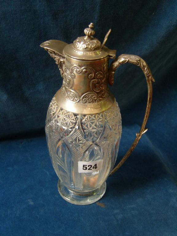 Appraisal: A cut glass decanter of baluster form with silver mounted