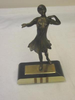 Appraisal: AN ART DECO SPELTER FIGURE modelled as a lady dancer