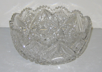 Appraisal: CUT GLASS BOWL With scalloped rim cut with spiraling and