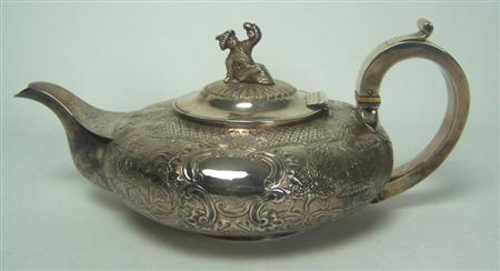 Appraisal: A William IV silver chinoiserie decorated teapot London of compressed